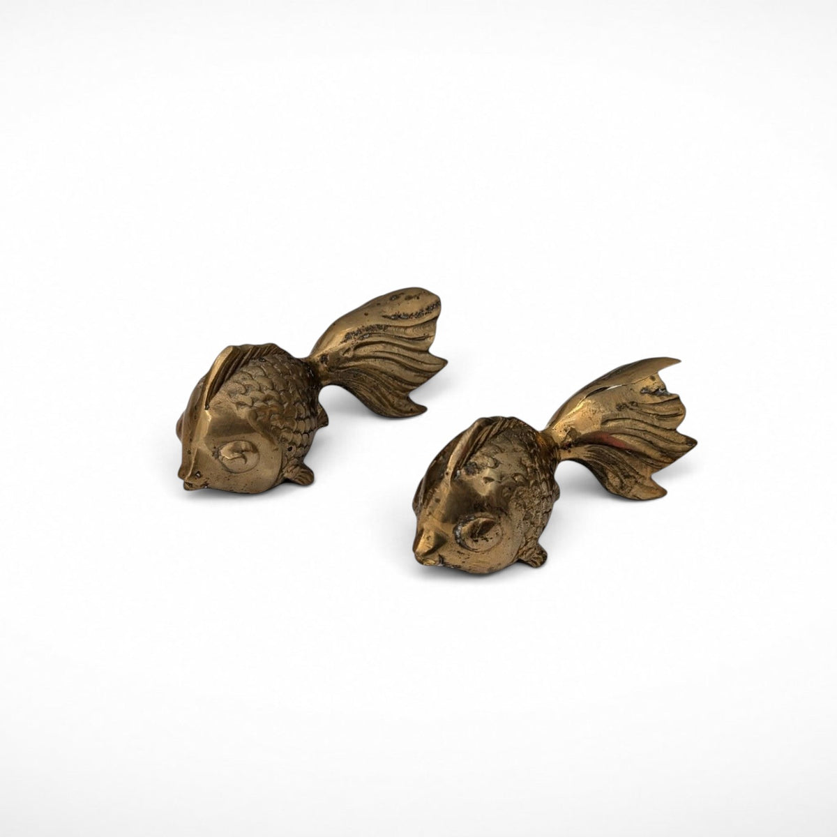 Pair of vintage brass koi fish paperweights, side view