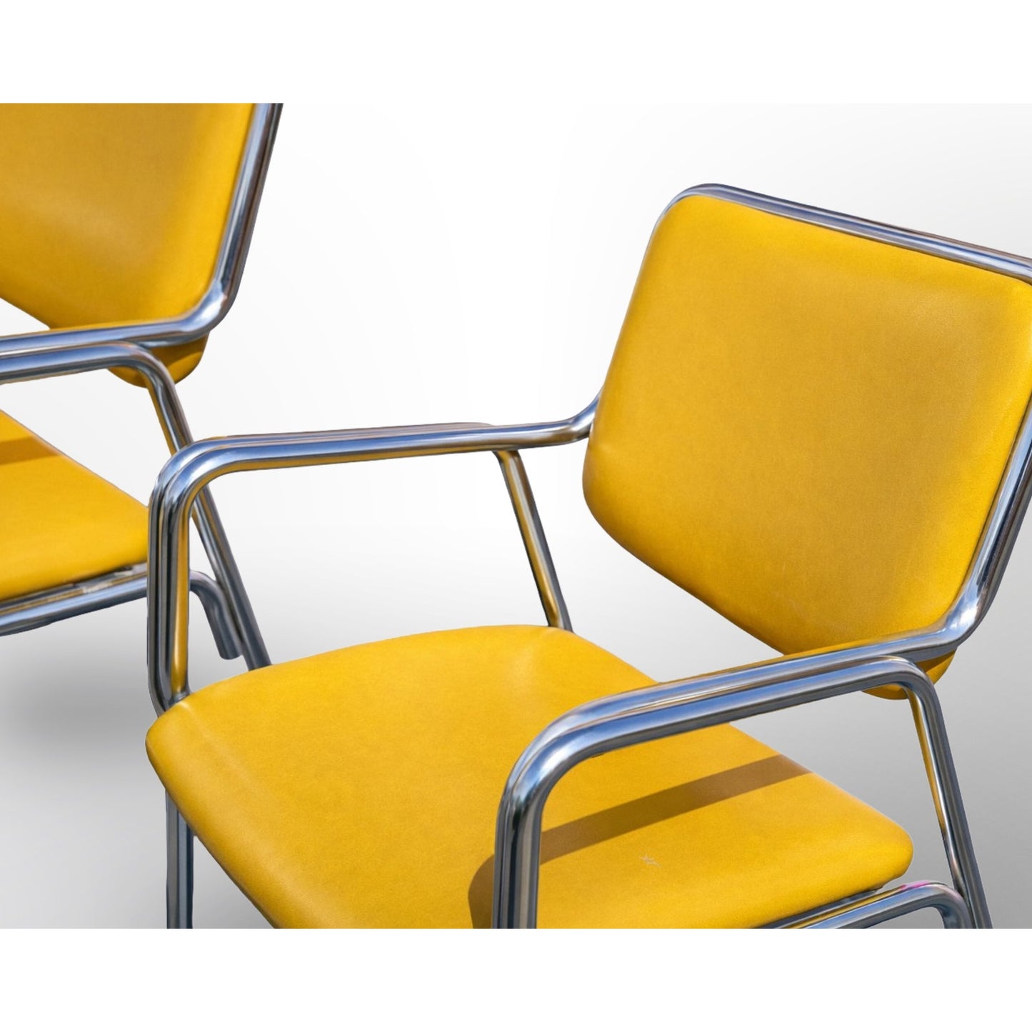 Mid century modern chrome dining chairs styled for dining room with clean modern aesthetic