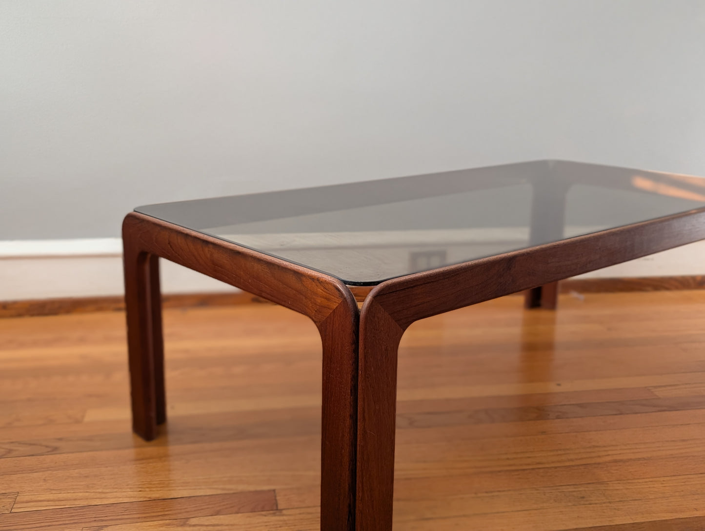 Vintage Scandinavian Teak Coffee Table with Smoked Glass Top – Mid-Century Modern Elegance