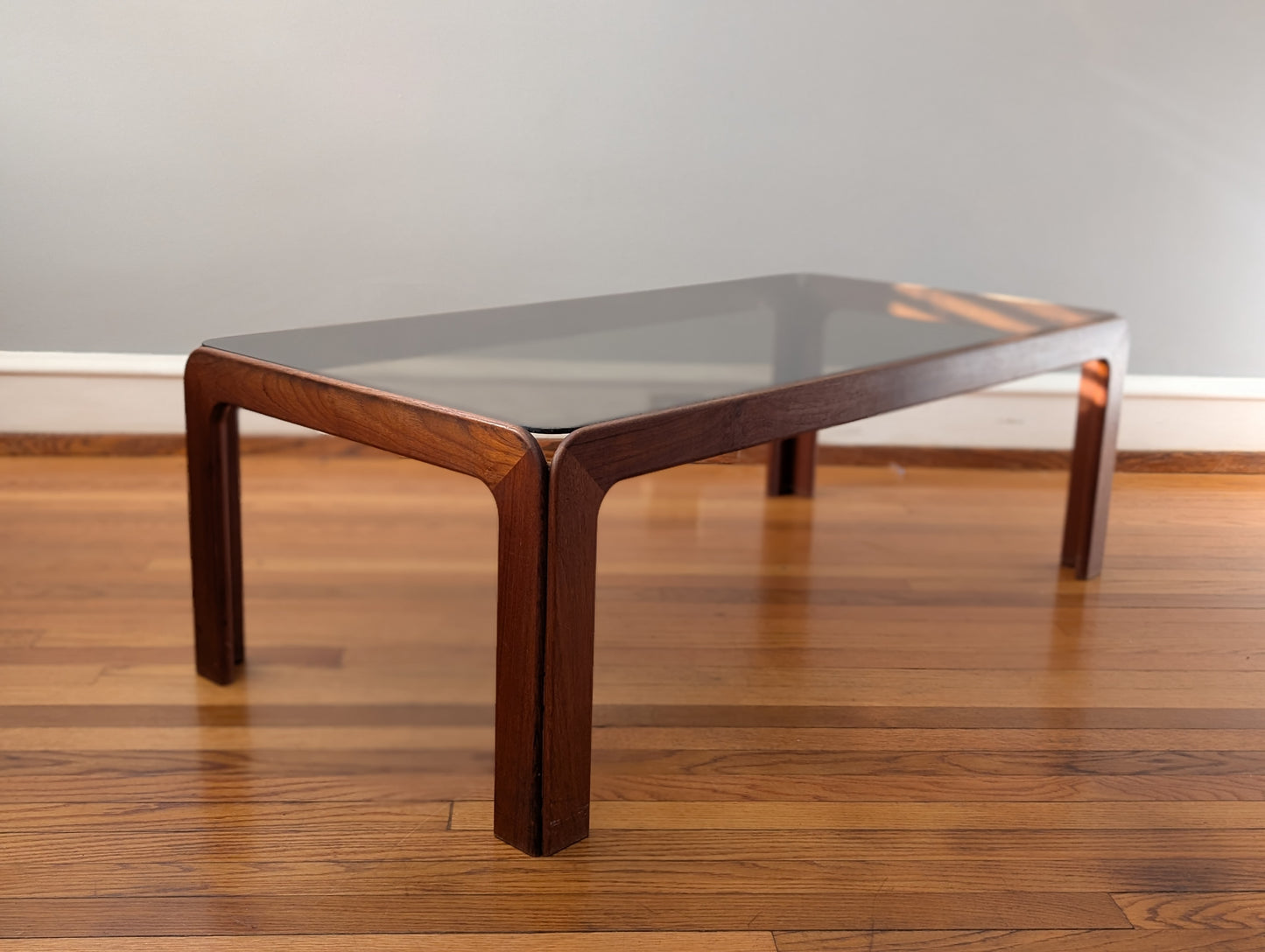 Vintage Scandinavian Teak Coffee Table with Smoked Glass Top – Mid-Century Modern Elegance