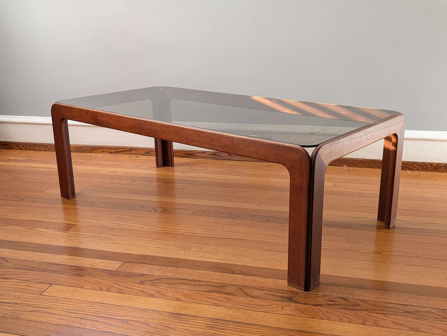 Vintage Scandinavian Teak Coffee Table with Smoked Glass Top – Mid-Century Modern Elegance