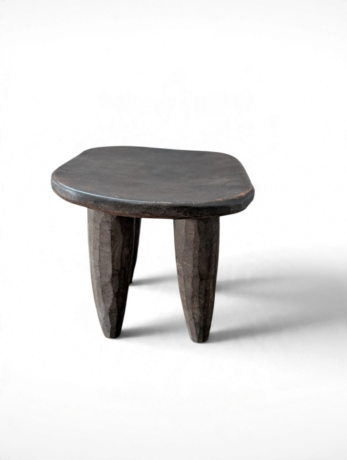 Vintage rustic hand-carved African Senufo stool, solid wood, four tapered legs, 11.75x10x9.5 inches tall