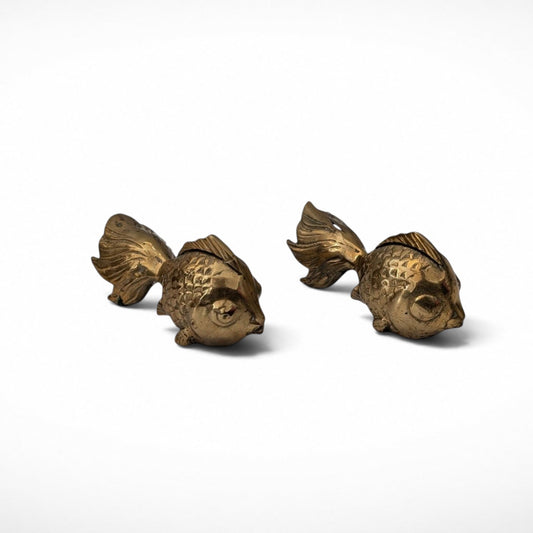 Pair of vintage brass koi fish paperweights, angled view