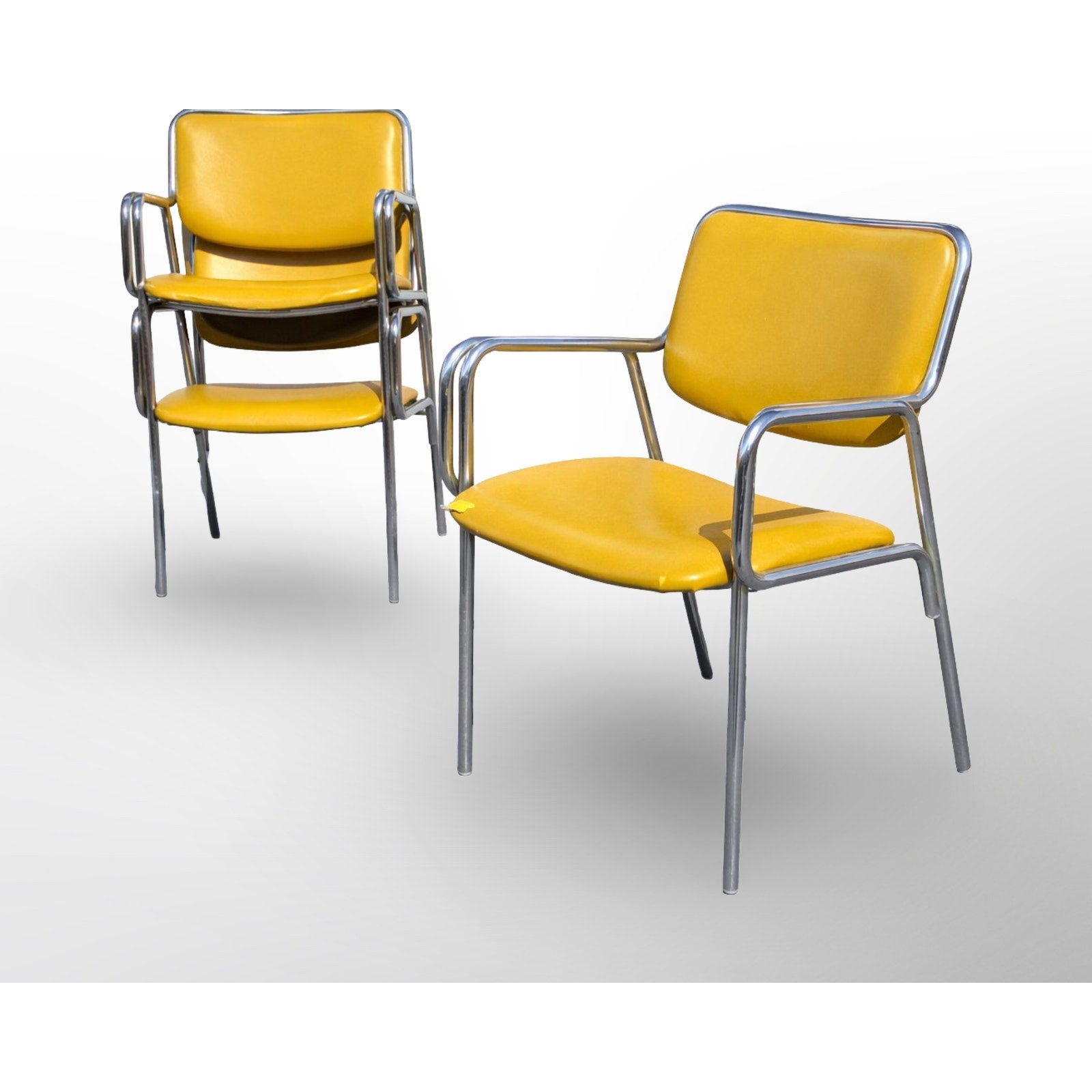 Set of six mid century modern chrome dining chairs arranged together showing cohesive modern design