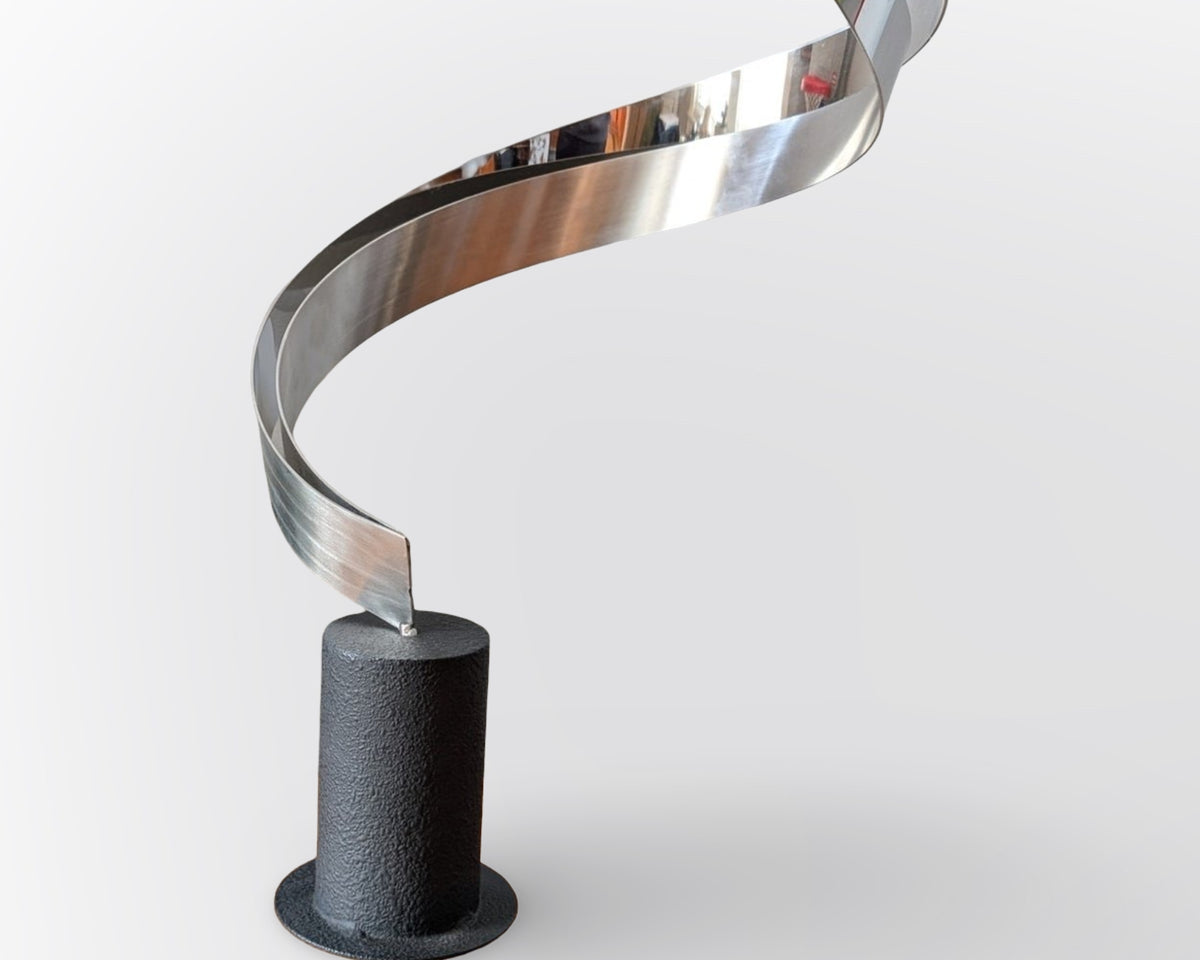 Vintage signed Curtis Jere ribbon swirl sculpture with heavy base in mid century modern abstract metal design