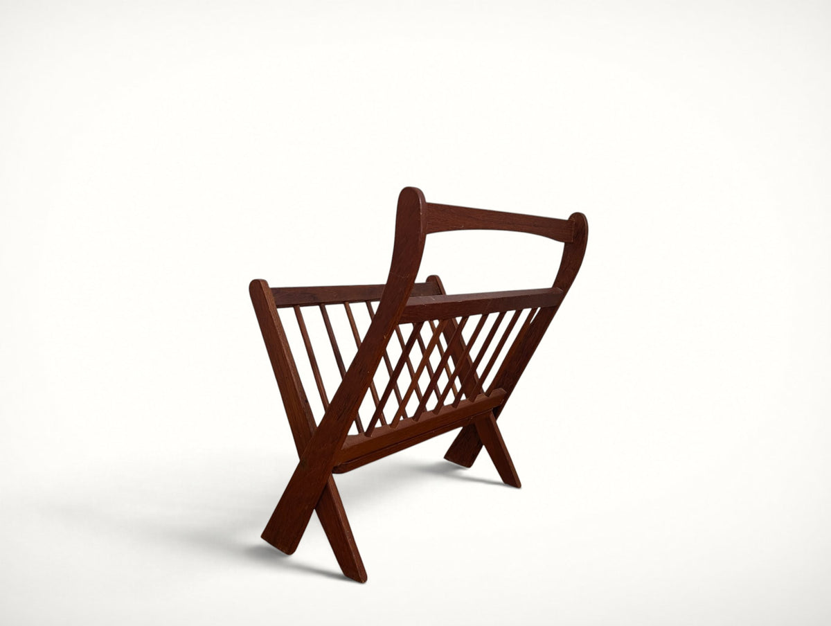 Opposite side view of the solid teak spindle magazine rack with diamond-pattern spindles
