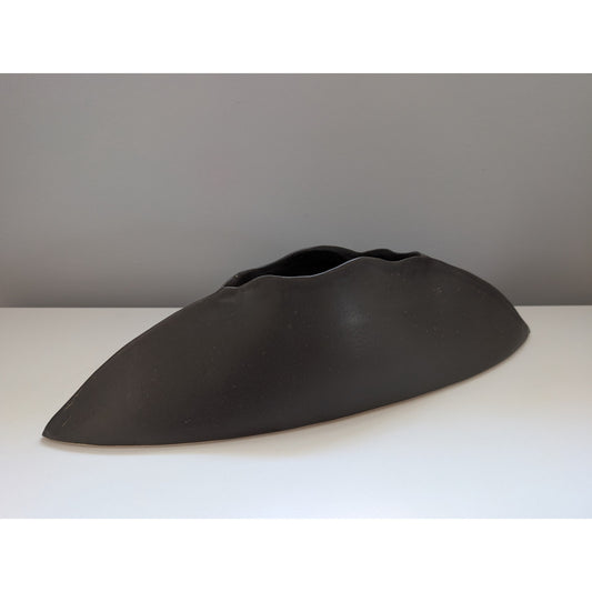 Elongated black studio pottery planter with modernist mid century ceramic design