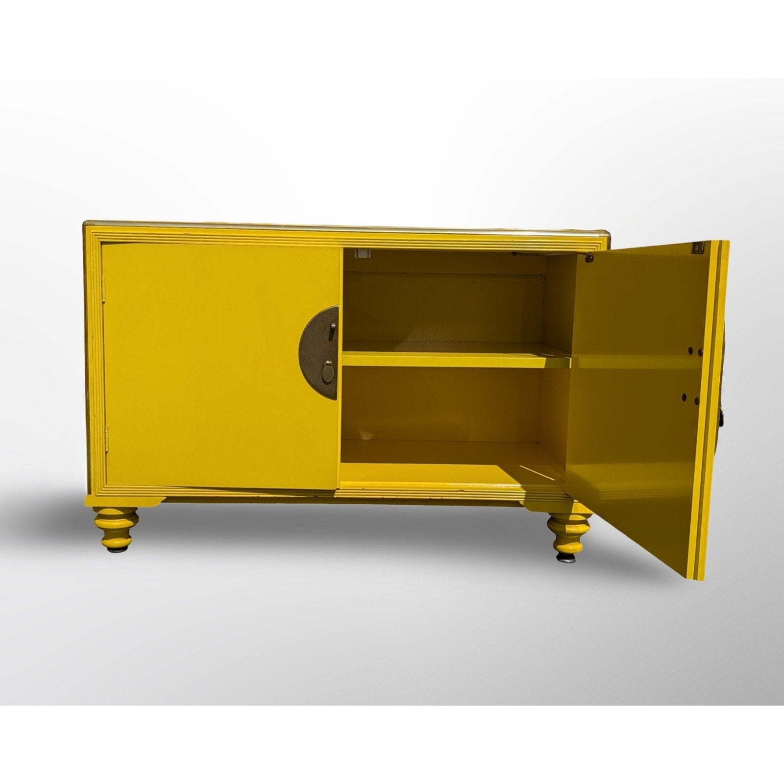 Close up of high gloss yellow lacquer finish on Baker Far East Collection cabinet
