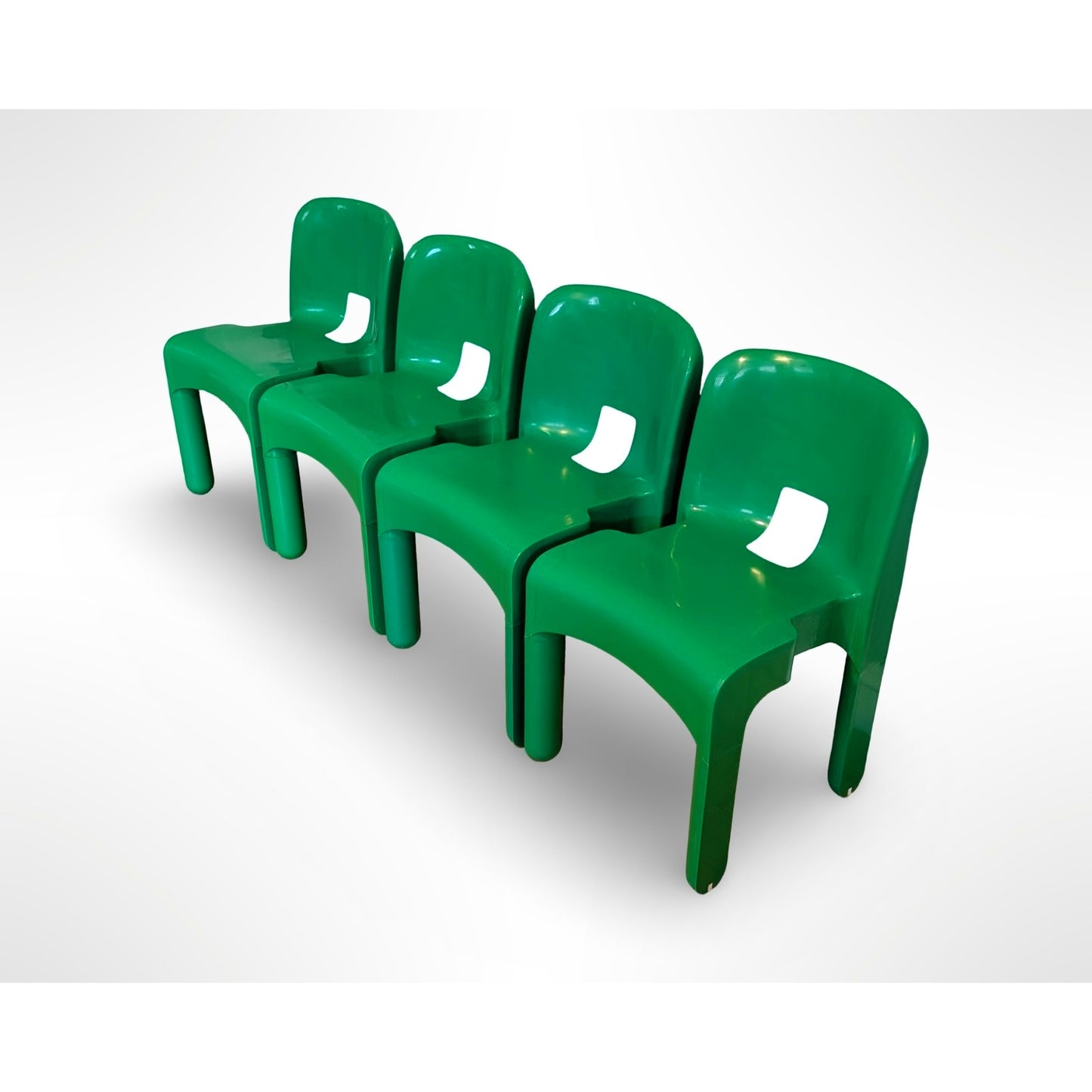 Set of four Joe Colombo Universale Model 4868 chairs for Kartell in green injection molded plastic Italian mid century modern design