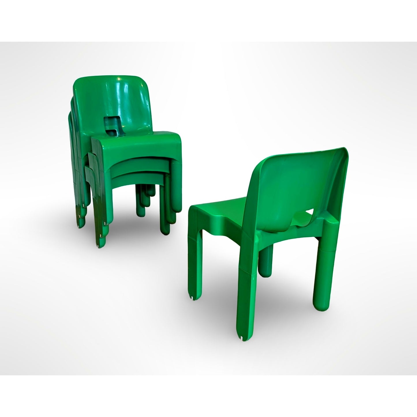 Set of four Joe Colombo Universale Model 4868 chairs for Kartell in green injection molded plastic Italian mid century modern design