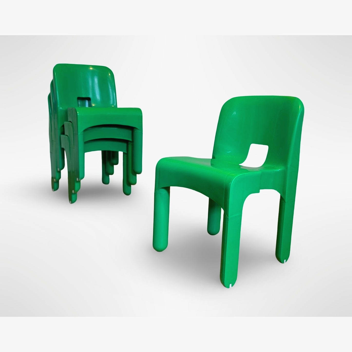 Set of four Joe Colombo Universale Model 4868 chairs for Kartell in green injection molded plastic Italian mid century modern design