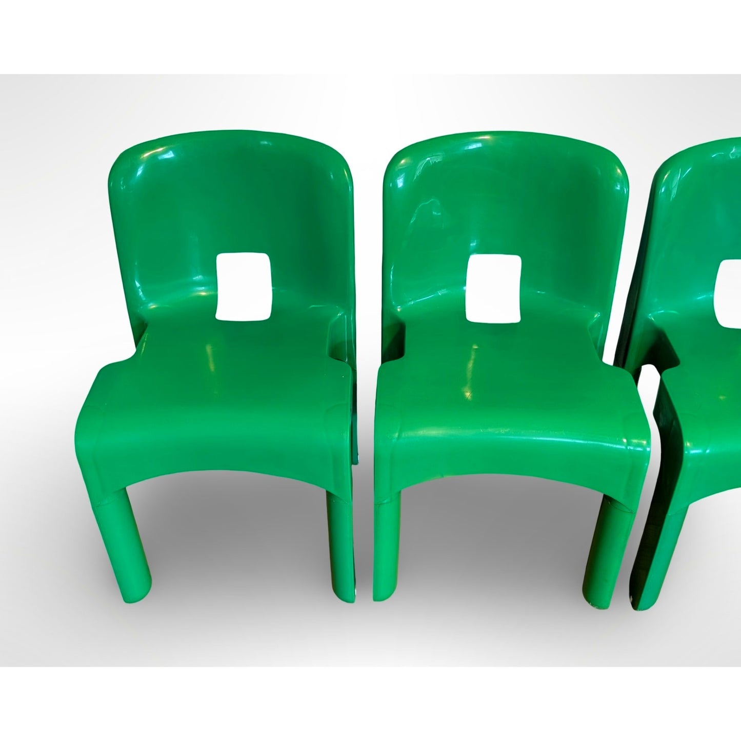 Set of four Joe Colombo Universale Model 4868 chairs for Kartell in green injection molded plastic Italian mid century modern design