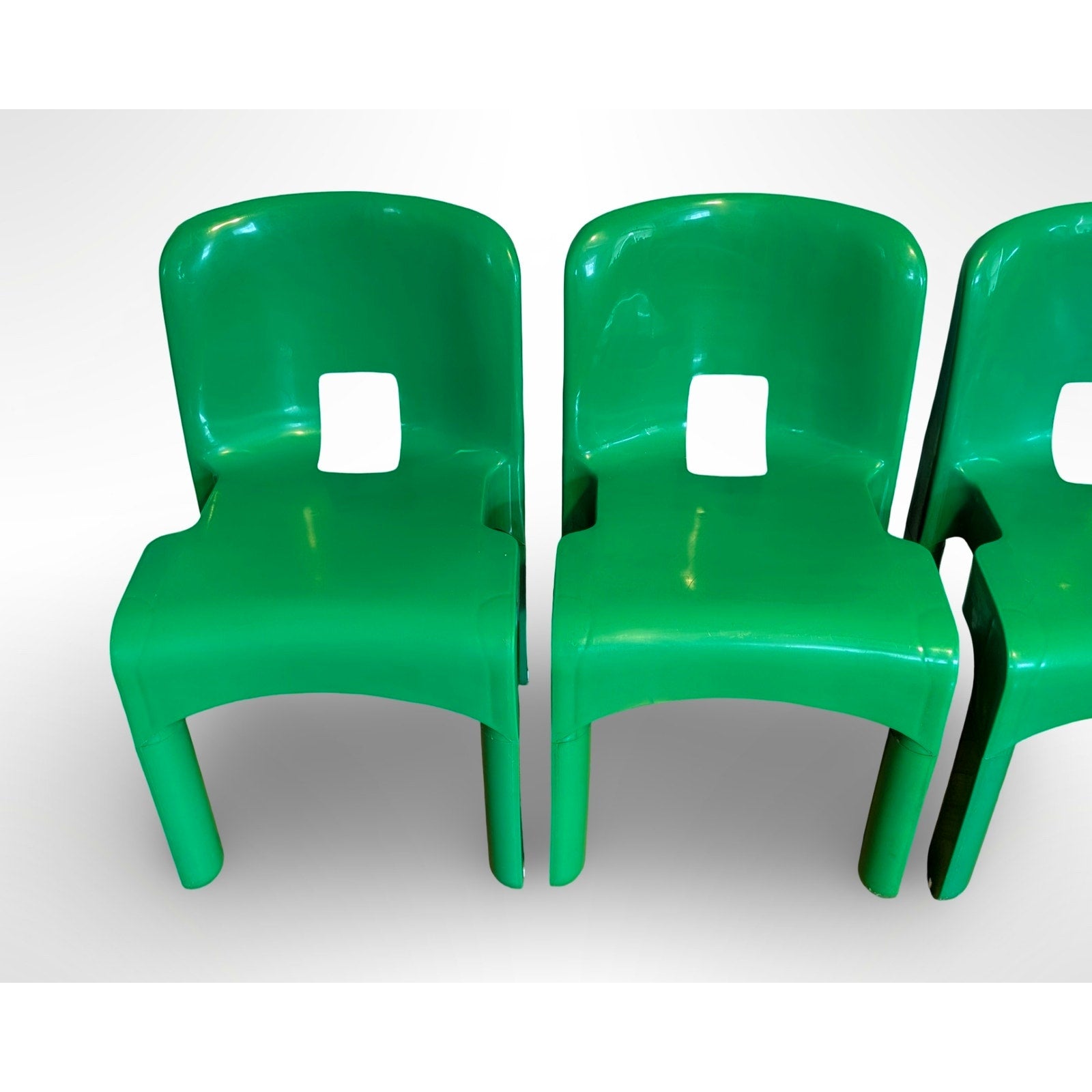 Set of four Joe Colombo Universale Model 4868 chairs for Kartell in green injection molded plastic Italian mid century modern design