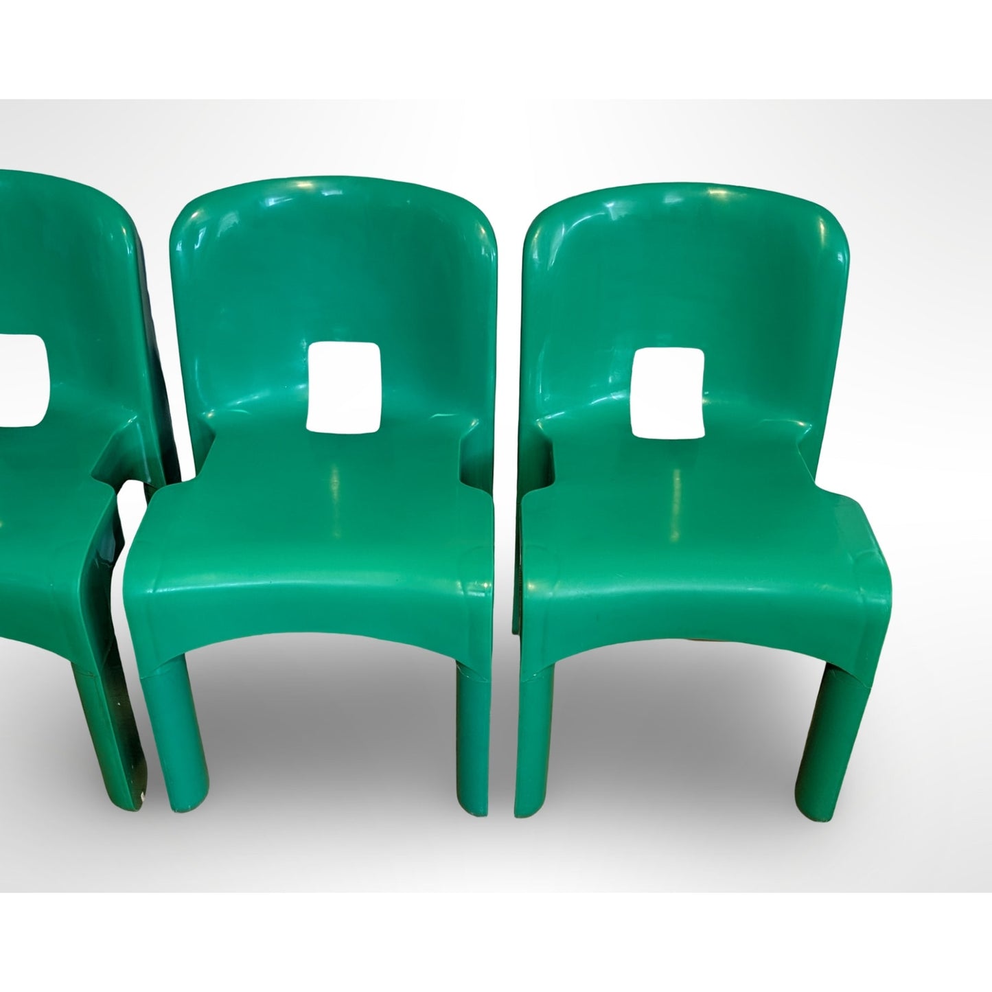 Set of four Joe Colombo Universale Model 4868 chairs for Kartell in green injection molded plastic Italian mid century modern design