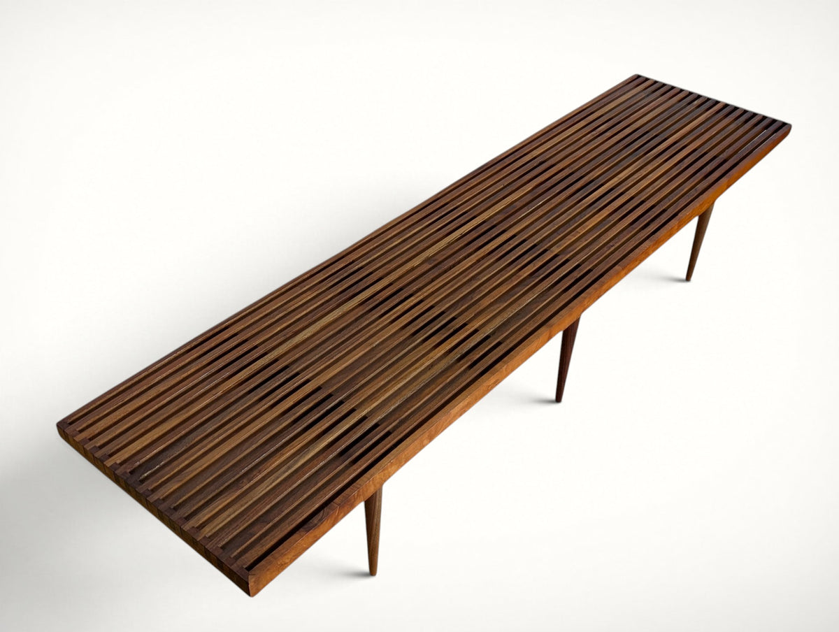Angled top view of the vintage walnut slat bench showing the full 72 inch slatted surface