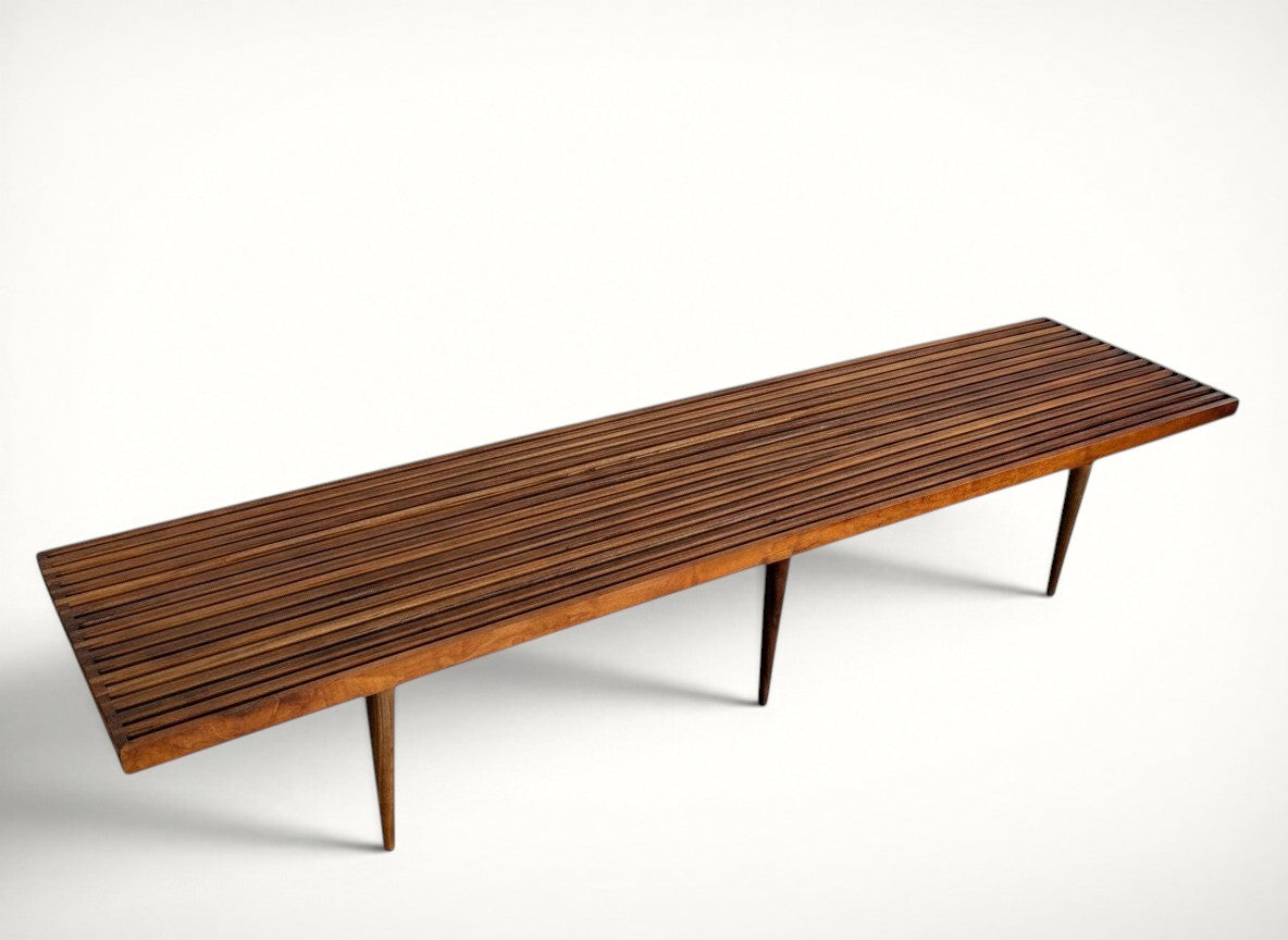 Mel Smilow walnut slat bench, extra long 72 inch, three-quarter view showing slatted top and tapered legs