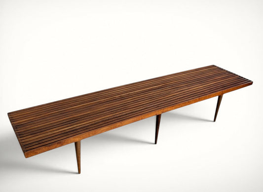 Mel Smilow walnut slat bench, extra long 72 inch, three-quarter view showing slatted top and tapered legs
