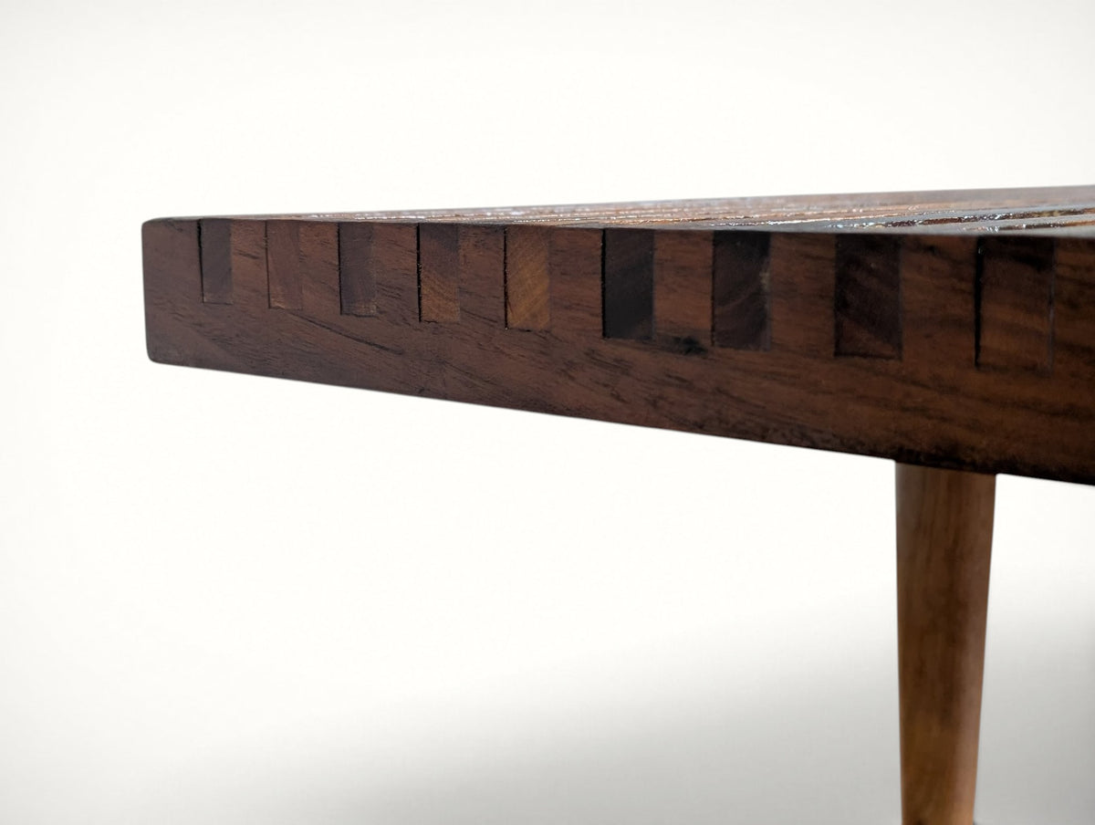 Edge close-up of the bench top showing the finger-jointed slat construction