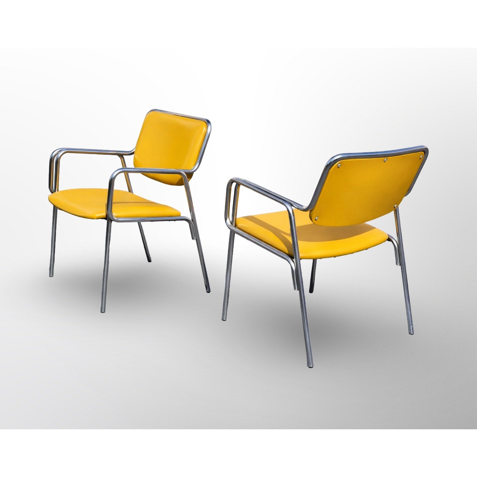 Close up detail of chrome frame and upholstery on mid century modern dining chair