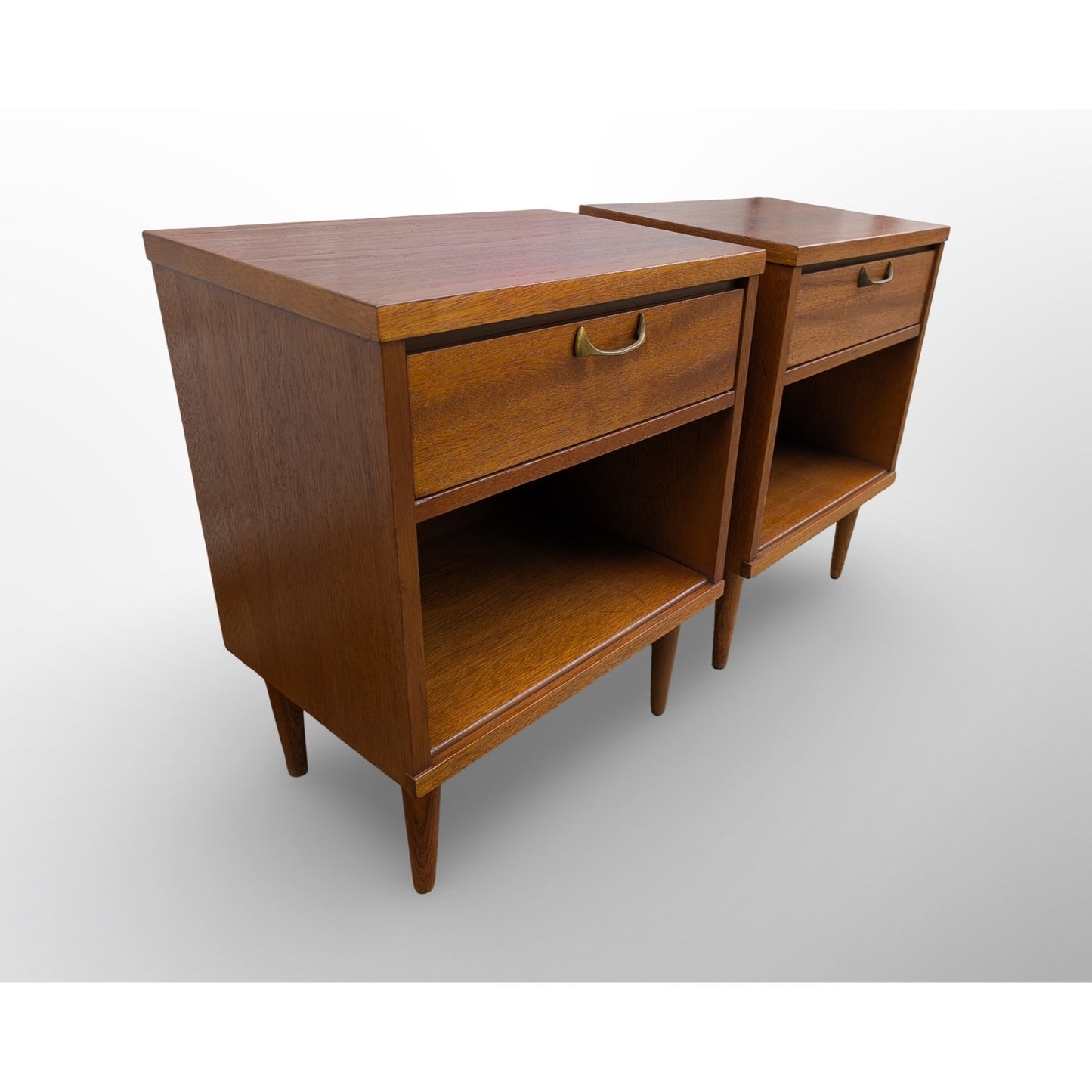 Pair of restored mid century modern walnut nightstands with brass pulls and minimalist design