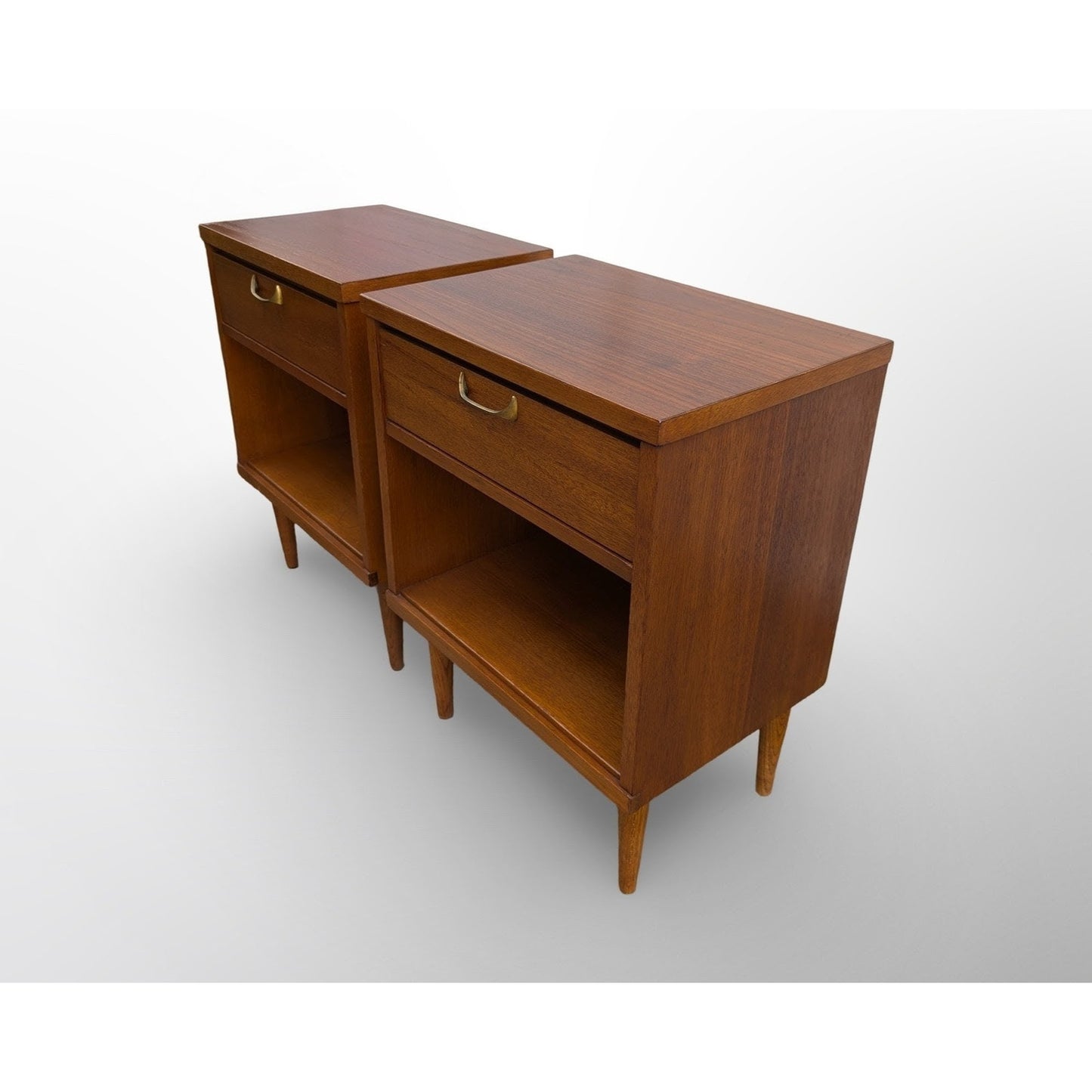 Pair of restored mid century modern walnut nightstands with brass pulls and minimalist design
