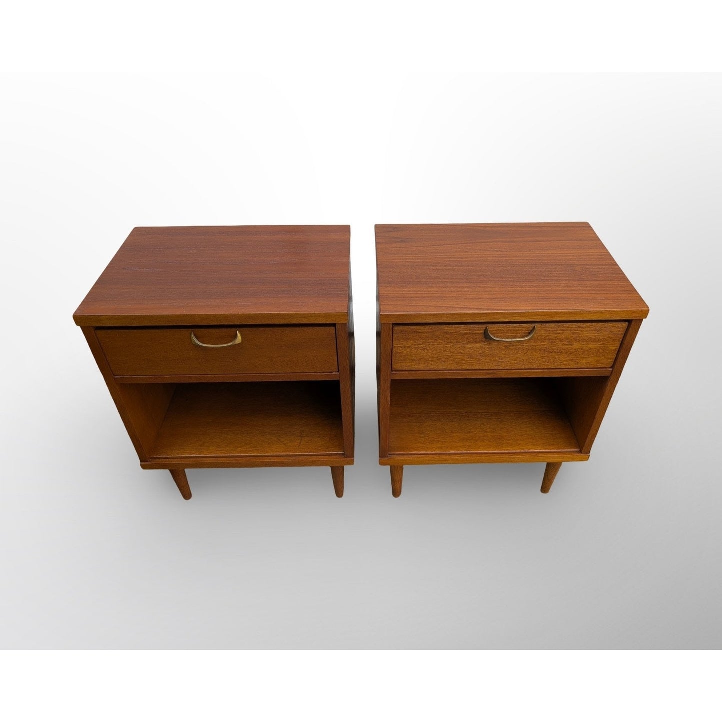 Pair of restored mid century modern walnut nightstands with brass pulls and minimalist design