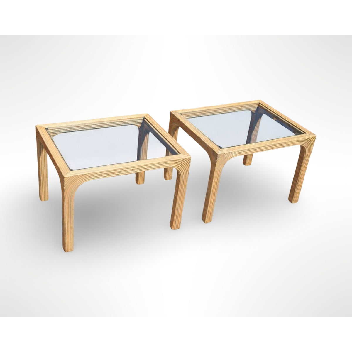 Pair of vintage split reed side tables with removable glass tops in a mid century modern organic design