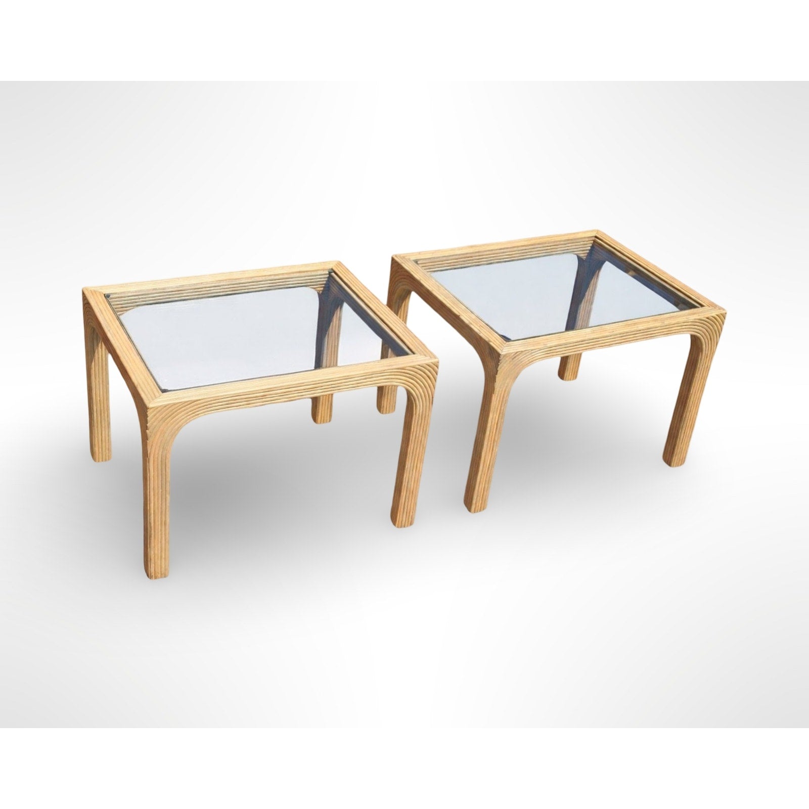 Pair of vintage split reed side tables with removable glass tops in a mid century modern organic design
