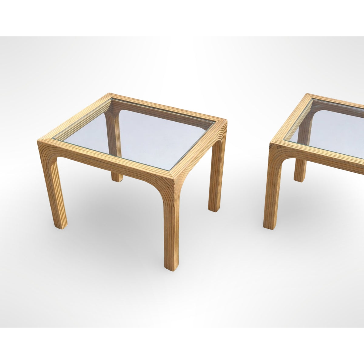 Pair of vintage split reed side tables with removable glass tops in a mid century modern organic design