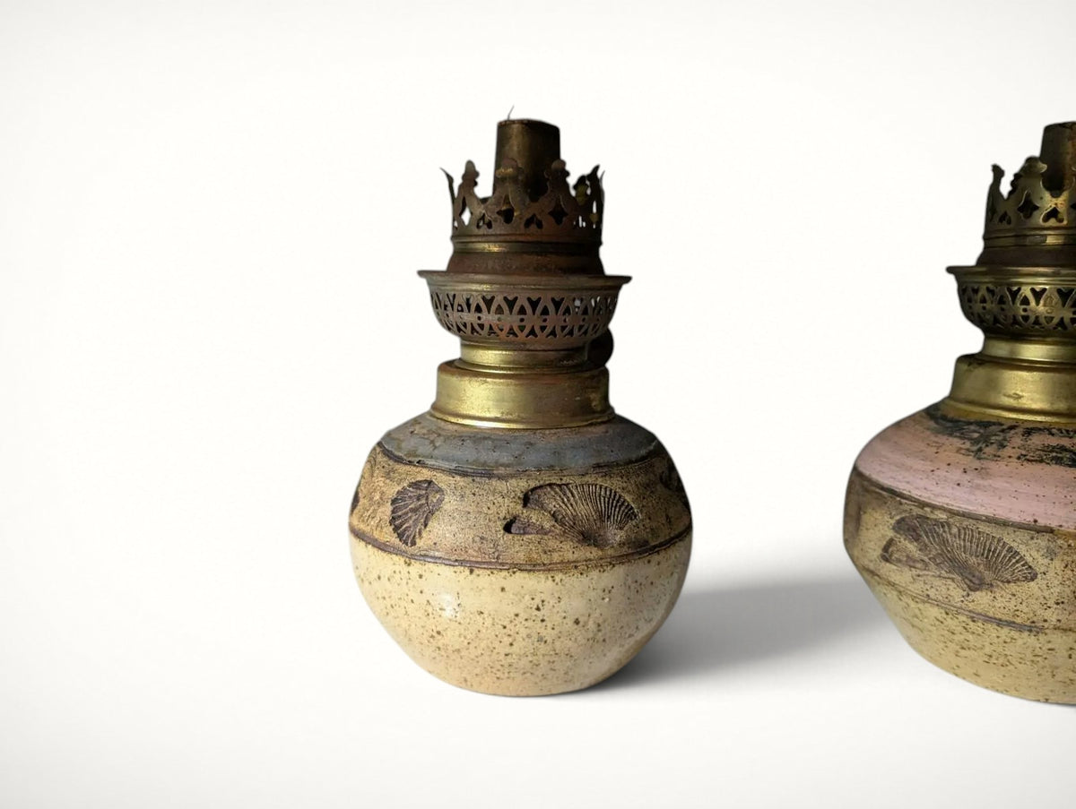 Single grey studio pottery oil lamp with seashell motif