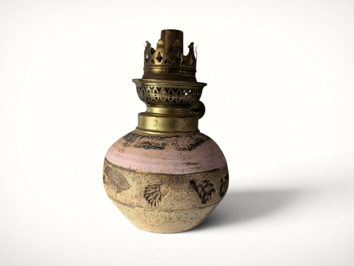 Single pink studio pottery oil lamp with seashell motif