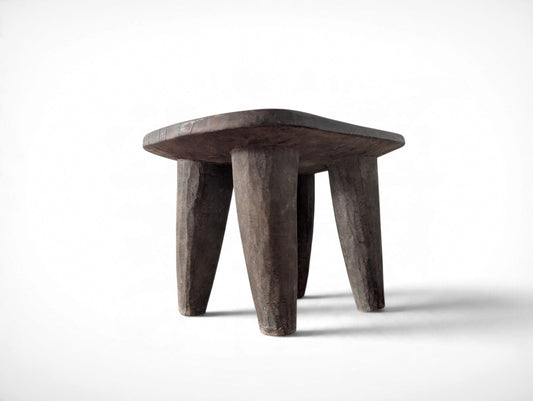 Vintage rustic African Senufo stool with four tapered legs and carved wood seat, 13.25 x 9.75 x 8.75 inches tall