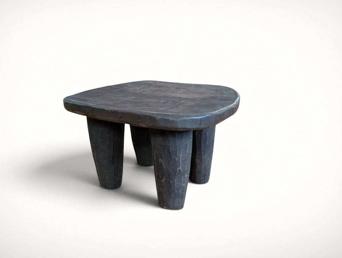 Small vintage African Senufo stool, front view — hand-carved solid wood with dished seat and four chunky tapered legs