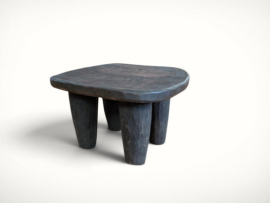 Small vintage African Senufo stool, front view — hand-carved solid wood with dished seat and four chunky tapered legs