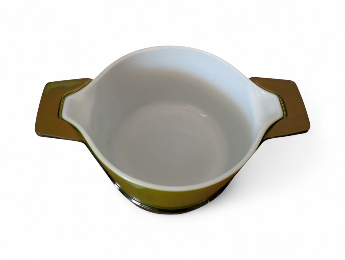 Vintage avocado green one-quart casserole with white opal ware lid featuring a purple grapes pattern and original green glass hugger cradle, 1973