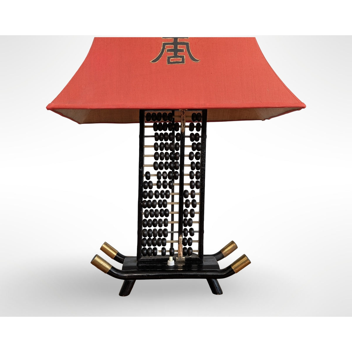Vintage Chinese abacus table lamp with black finish, brass accents, and original silk pagoda shade