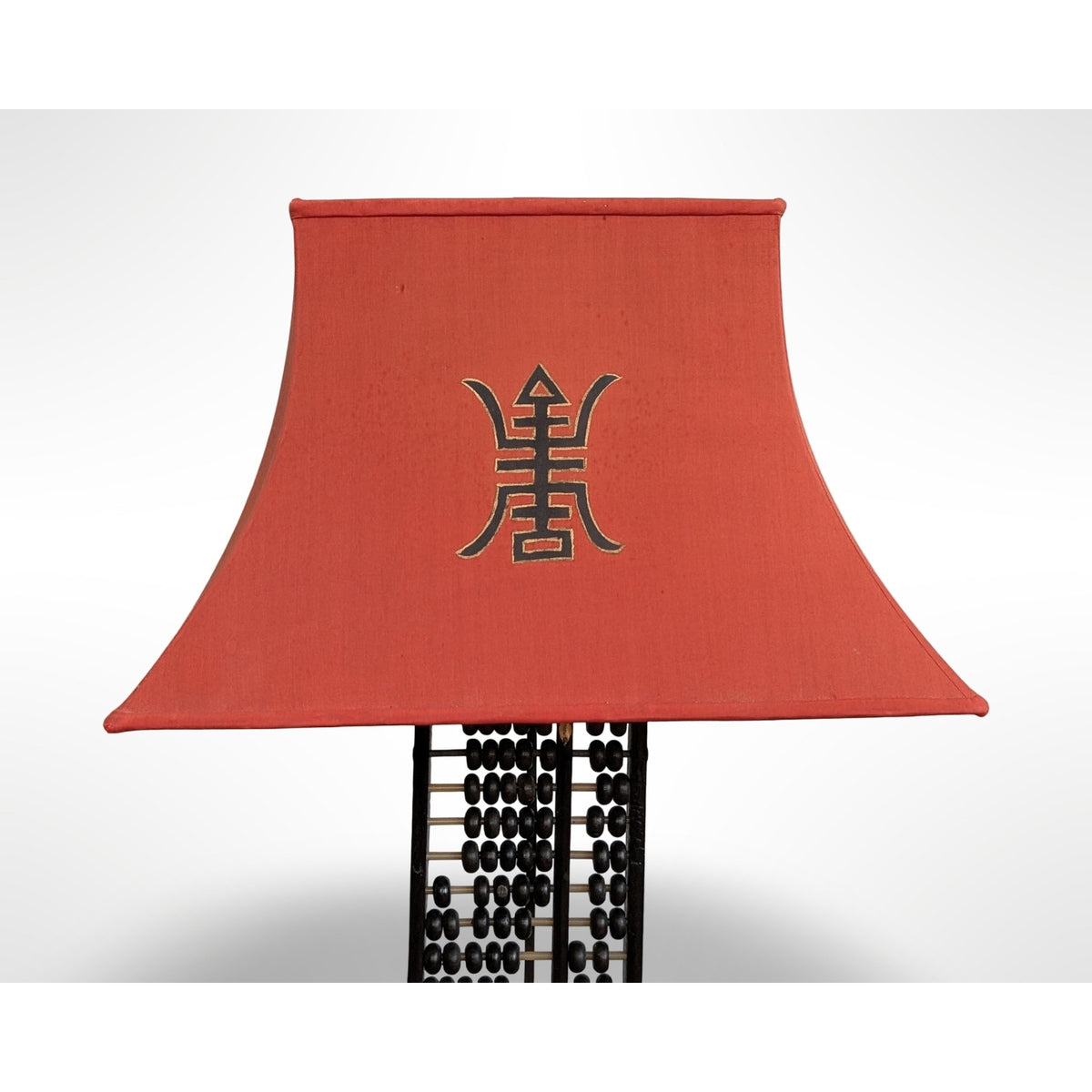 Vintage Chinese abacus table lamp with black finish, brass accents, and original silk pagoda shade
