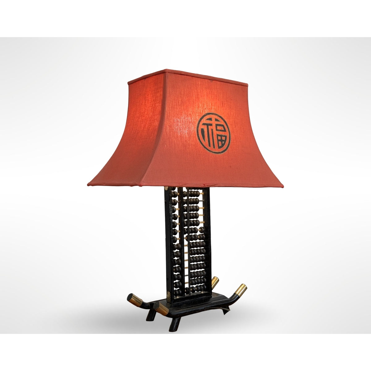 Vintage Chinese abacus table lamp with black finish, brass accents, and original silk pagoda shade