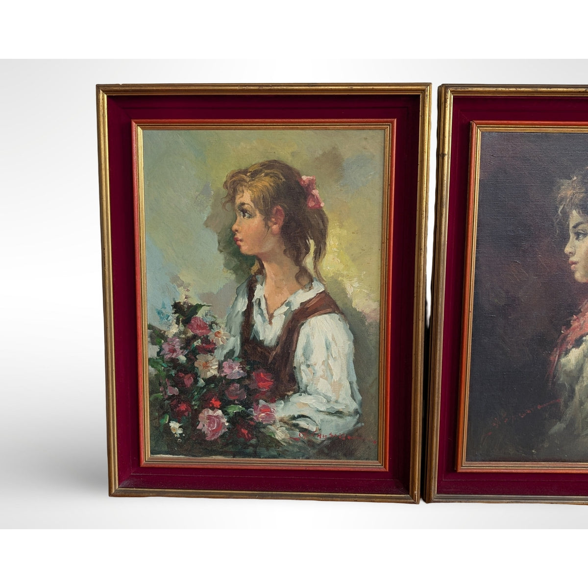 Pair of vintage signed portrait oil paintings in gilt wood frames with red velvet liners measuring 27 by 35 inches