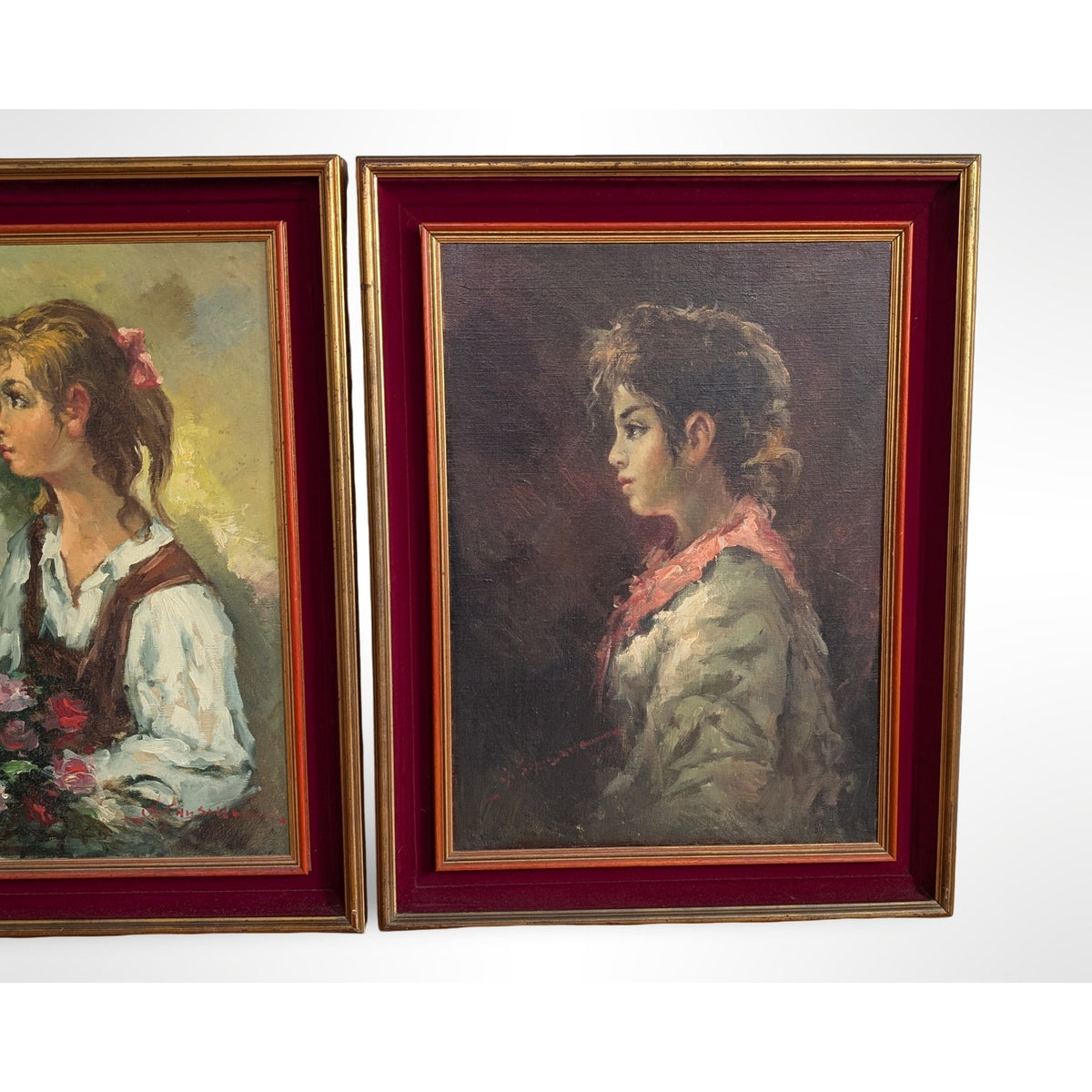 Pair of vintage signed portrait oil paintings in gilt wood frames with red velvet liners measuring 27 by 35 inches