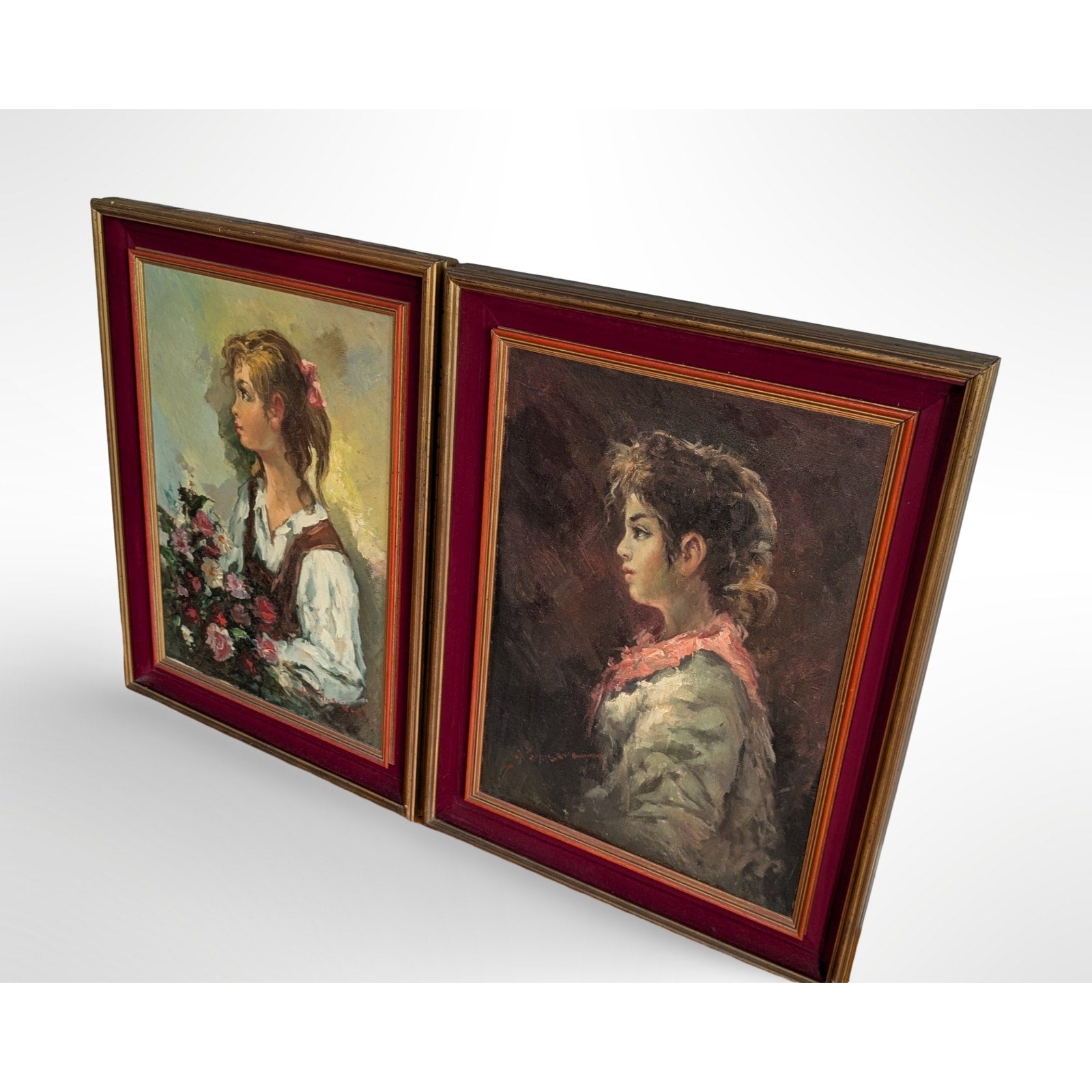 Pair of vintage signed portrait oil paintings in gilt wood frames with red velvet liners measuring 27 by 35 inches