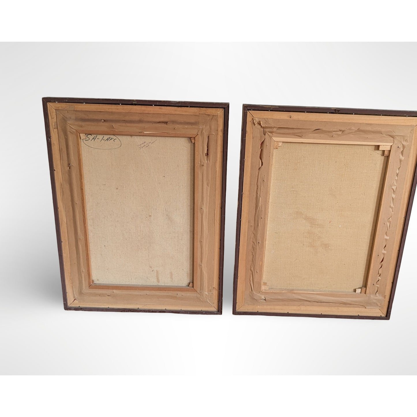 Pair of vintage signed portrait oil paintings in gilt wood frames with red velvet liners measuring 27 by 35 inches