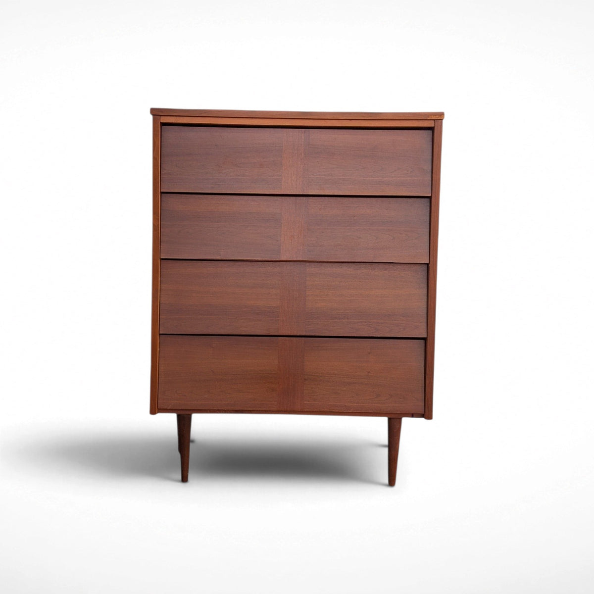 Restored Ward Mfg. mid century modern walnut tall 4-drawer dresser with sculpted geometric drawer fronts and tapered legs