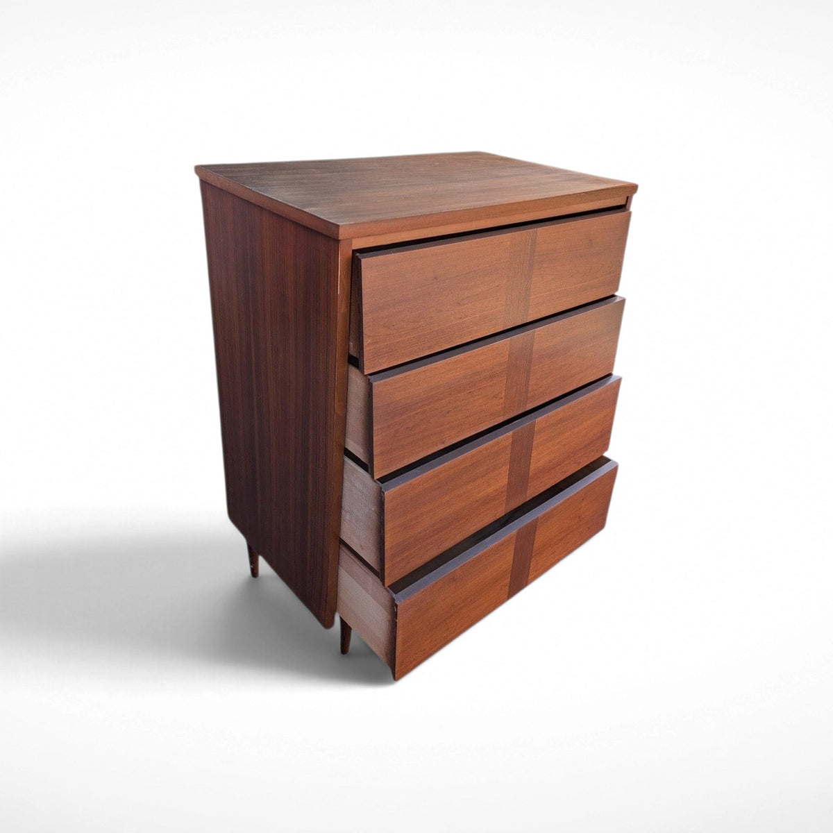Restored Ward Mfg. mid century modern walnut tall 4-drawer dresser with sculpted geometric drawer fronts and tapered legs