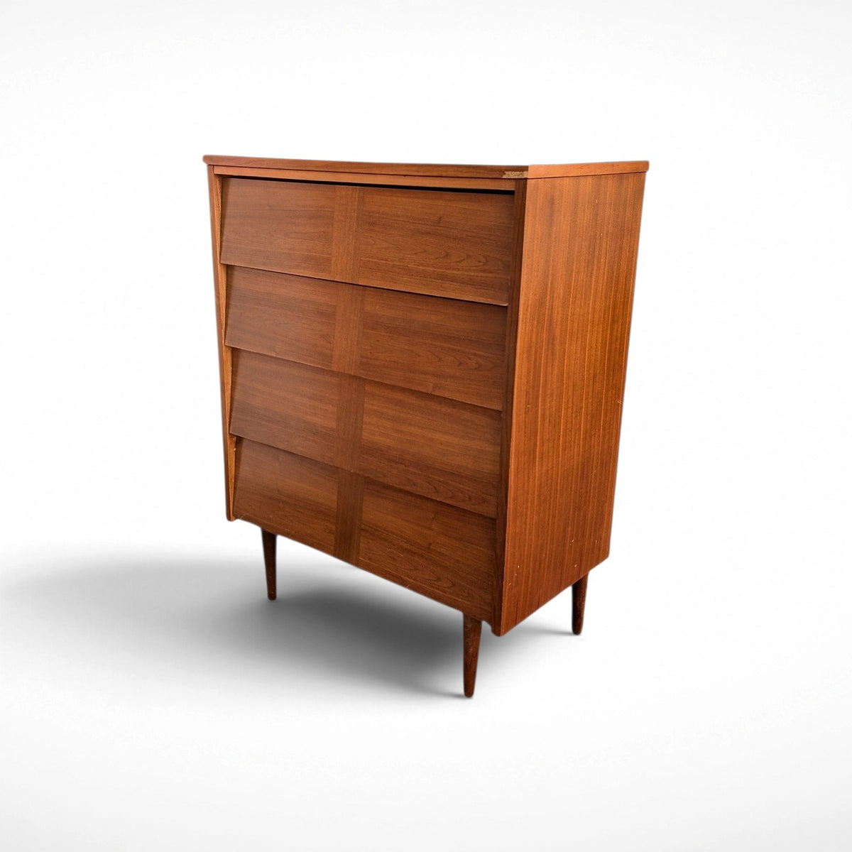Restored Ward Mfg. mid century modern walnut tall 4-drawer dresser with sculpted geometric drawer fronts and tapered legs