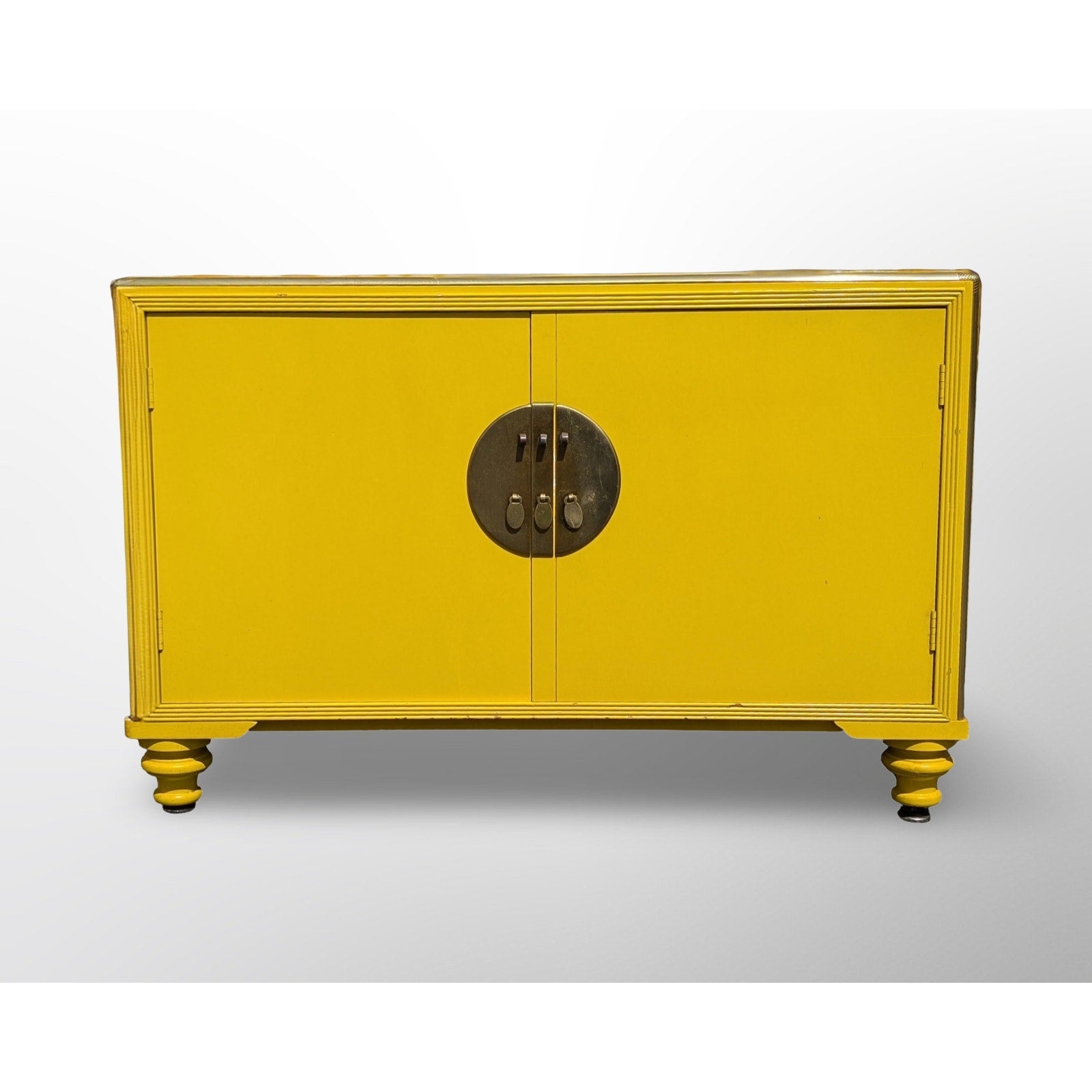 Side profile of Michael Taylor for Baker yellow lacquer cabinet mid century modern design